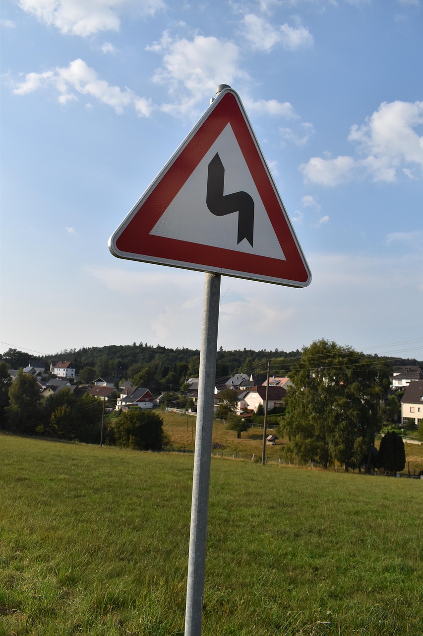 sign, attention, double curve, left, traffic, a notice, warning, danger, traffic sign, warning sign, street sign, traffic signs, caution, road, warning notice, warning signs, village, meadow